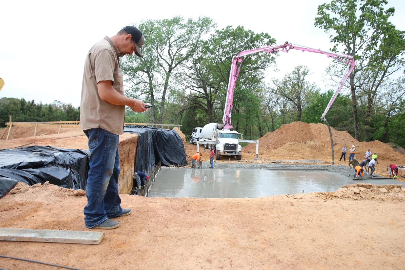 Hands-on oversight of a concrete pour at a BryanMark construction site